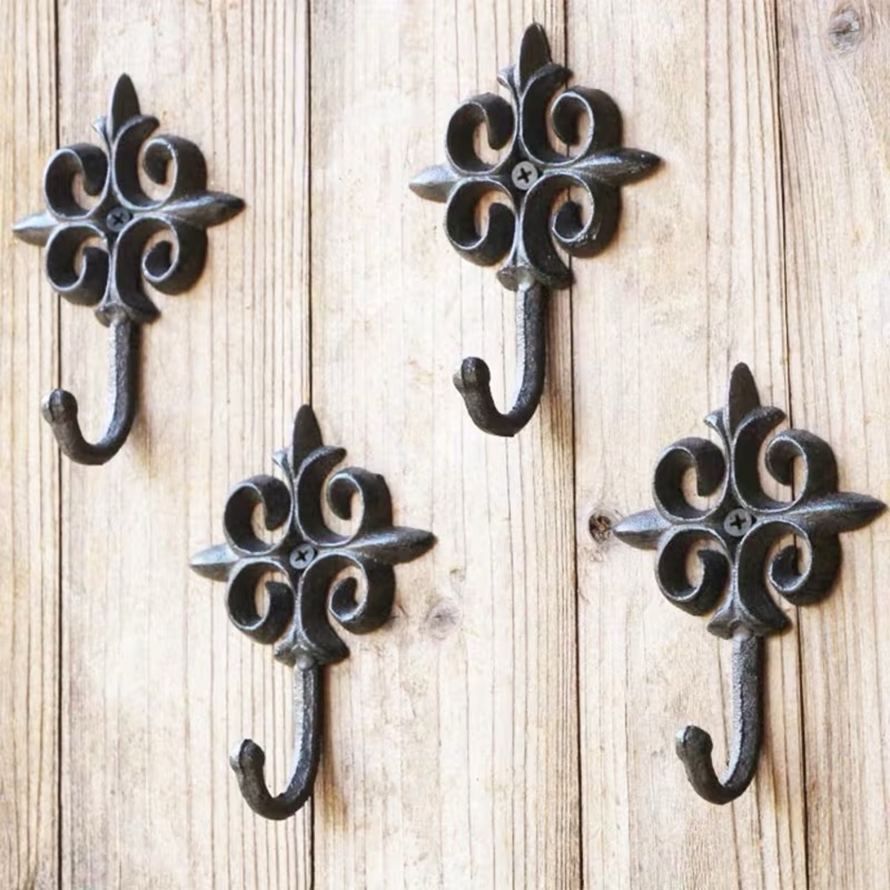 FOUR CAST IRON WALL HOOKS